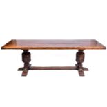 A well-made Elizabethan-style English oak refectory table, mid-20th century, with a heavy cleated