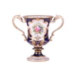 A Royal Crown Derby bone China bleu de roi loving cup painted with a posy of summer flowers by