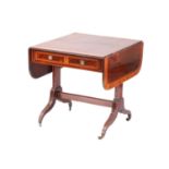 A Sheraton period satinwood crossbanded mahogany sofa table, the top inlaid with running bands of