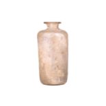 A Roman glass flask,1st/2nd century AD, with a cylindrical body and everted rim, with an