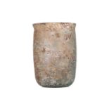A Roman glass beaker, circa 3rd century AD, of plain cylindrical form, with a silightly everted rim,