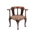 A George II "Red Walnut" bow-backed corner armchair with penny round arms above doric column