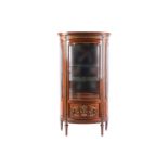 A Louis XVI style rosewood bowfront vitrine, the moulded cornice over a giltwood cabochon banded