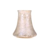 A Roman glass beaker with a faceted neck, 10cm high
