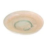 A rare Roman glass plate, probably 2nd century AD, with thick rolled rim and slight well to the