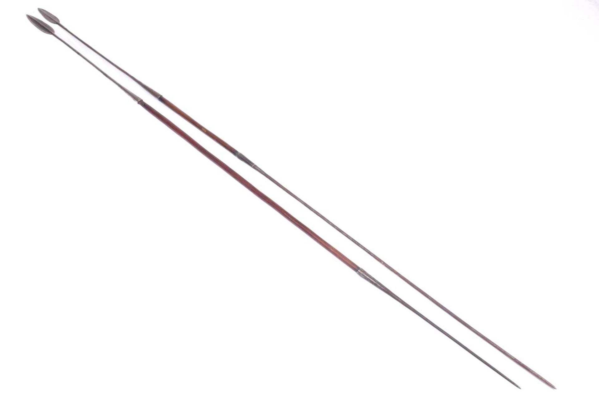 A large Maasai double-ended hunting spear, 20th century, with ridged double-sided iron blade and