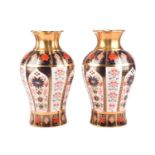 A pair of Royal Crown Derby 'Old Imari' heavy baluster vases, bearing the date marks for 2008, in