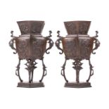 A pair of late Japanese patinated bronze Koro, Meiji/Taisho Period. the lozenge section urn bodies