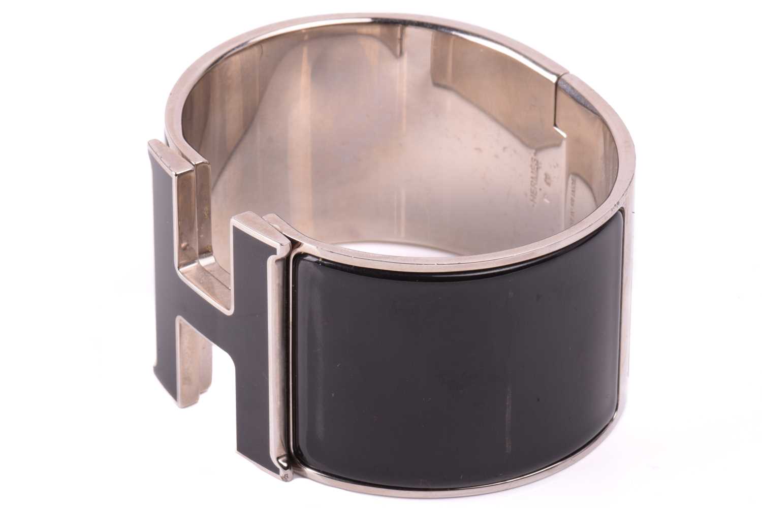 Hermès - an extra wide 'Clic Clac H' bracelet with black enamel and white-toned metal, signed and - Image 3 of 5