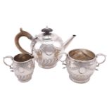 A three-piece bachelors silver tea set, by Pairpoint Brothers (John & Frank Pairpoint), London 1896,