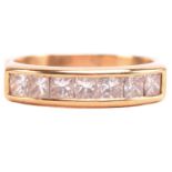 A diamond half hoop ring, set with a row of princess cut diamonds with a total estimated weight of
