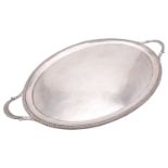 An early 20th-century heavy silver oval two-handled tray, London 1911 by Daniel & John Welby, the