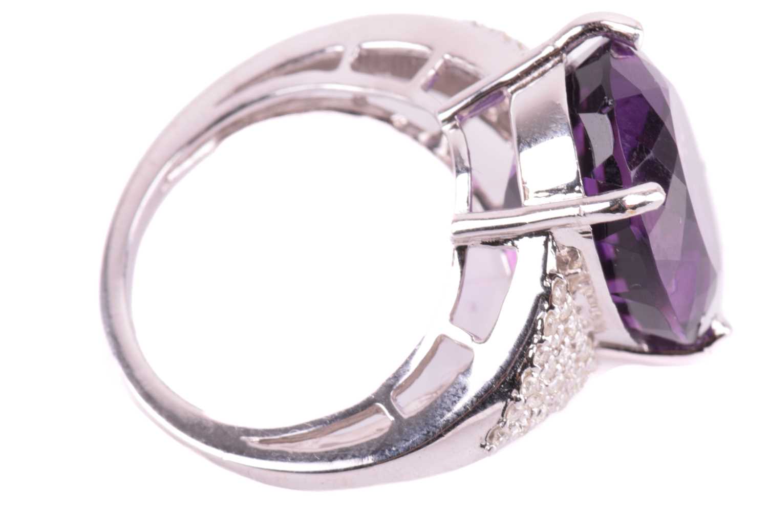 A large amethyst and diamond cocktail ring, featuring an oval-cut amethyst in deep purple colour, - Image 3 of 5
