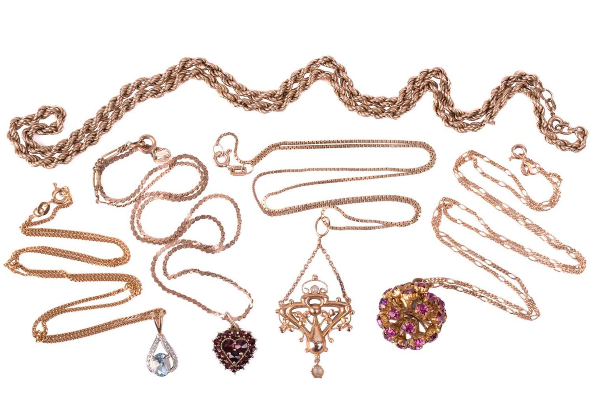 A collection of chains and pendants, featuring a yellow metal twisted rope chain stamped '375'. A