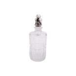 Georg Jensen. A silver-mounted cut glass decanter, the cylindrical panelled glass bottle with cast
