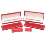 Les Must de Cartier - two boxed 'Vendôme Trinity' pens of crosshatch pattern; containing one