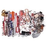 A large quantity of costume jewellery including six sleeve garters, various buttons, beaded