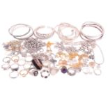 A collection of white metal jewellery including various bangles, bracelets, rings and necklaces with
