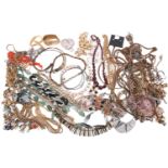 A large collection of costume jewellery including various base metal chains, beaded necklaces,