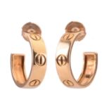 A pair of Cartier 'Love' earrings, each of hoop design with screw motifs, length 2cm, post fittings,