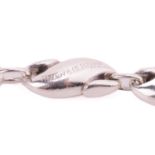 Tiffany & Co. - a seahorse link bracelet by Elsa Peretti, comprising thirteen S-shaped links,