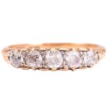 A diamond five stone carved half hoop ring, set with a graduated row of old cut diamonds with a