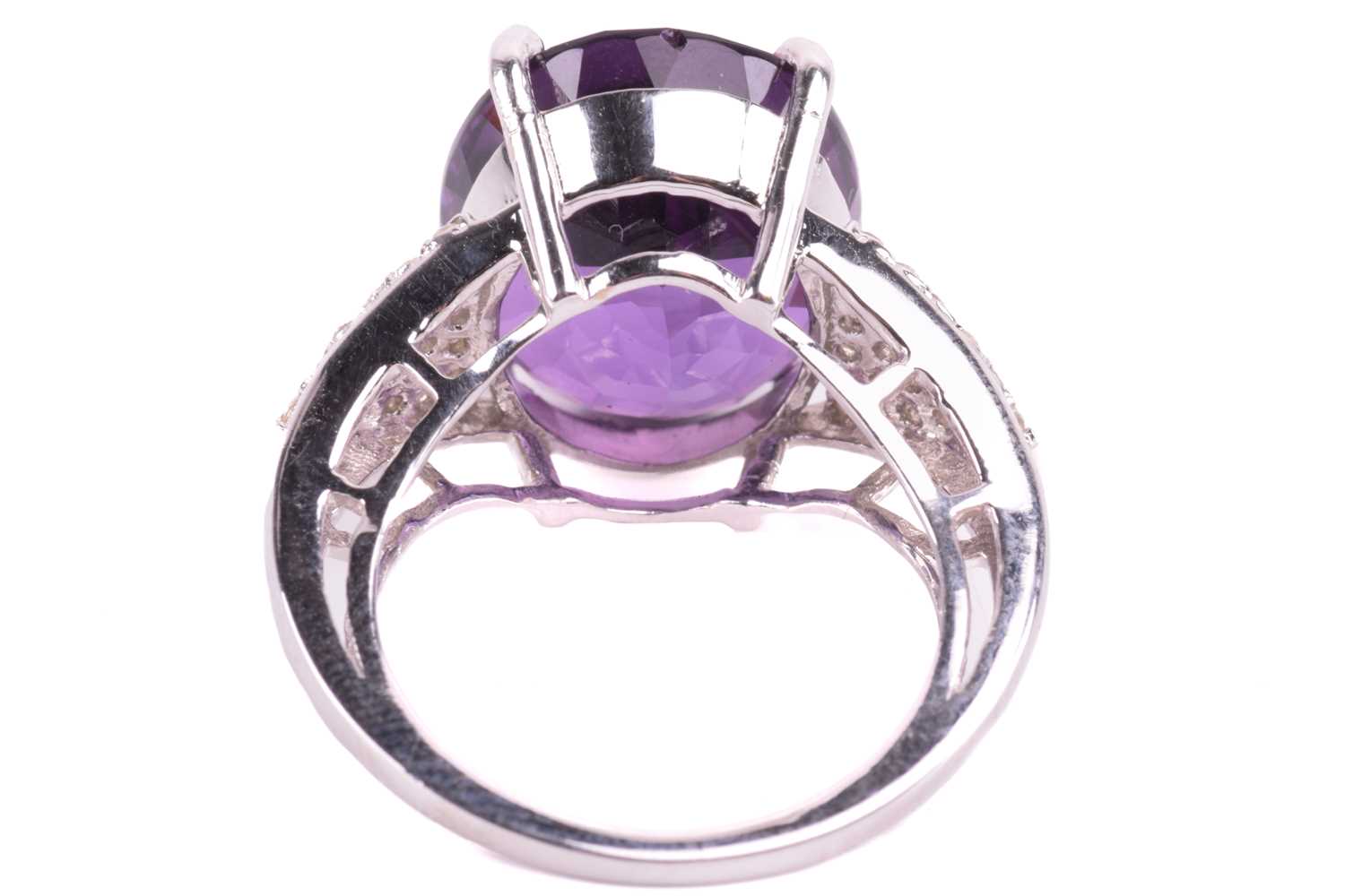 A large amethyst and diamond cocktail ring, featuring an oval-cut amethyst in deep purple colour, - Image 5 of 5