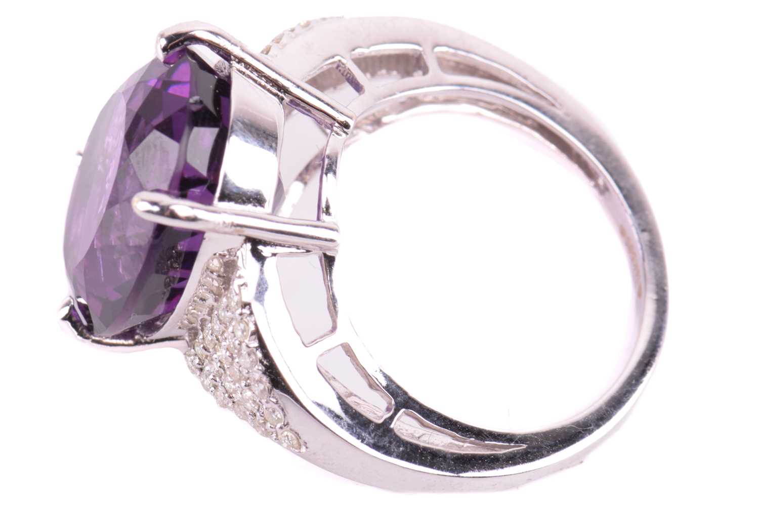 A large amethyst and diamond cocktail ring, featuring an oval-cut amethyst in deep purple colour, - Image 4 of 5