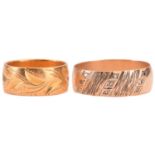 Two wide wedding rings in yellow gold; the first comprises a flat band of 8.0 mm wide, with bright-