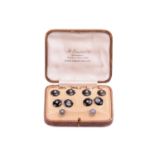 An Art Deco set of onyx cufflinks and dress studs with seed pearl centres, of octagon design, onyx