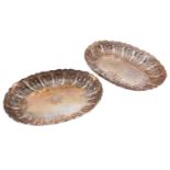 A pair of Victorian silver gilt Hunt & Roskell dishes of oval form the central base engraved with