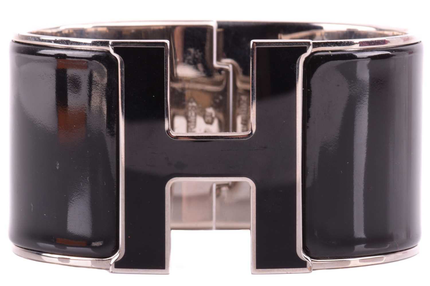 Hermès - an extra wide 'Clic Clac H' bracelet with black enamel and white-toned metal, signed and - Image 2 of 5