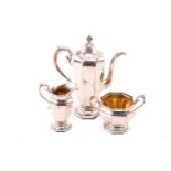 An early 20th-century Gorham silver three-piece bachelor's coffee set of panelled urn form, 25.5 ozt