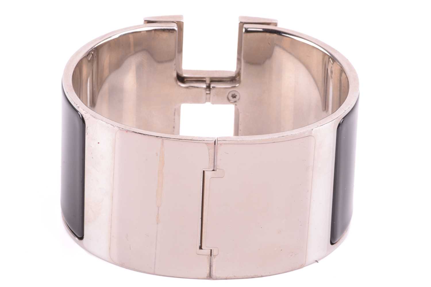 Hermès - an extra wide 'Clic Clac H' bracelet with black enamel and white-toned metal, signed and - Image 4 of 5