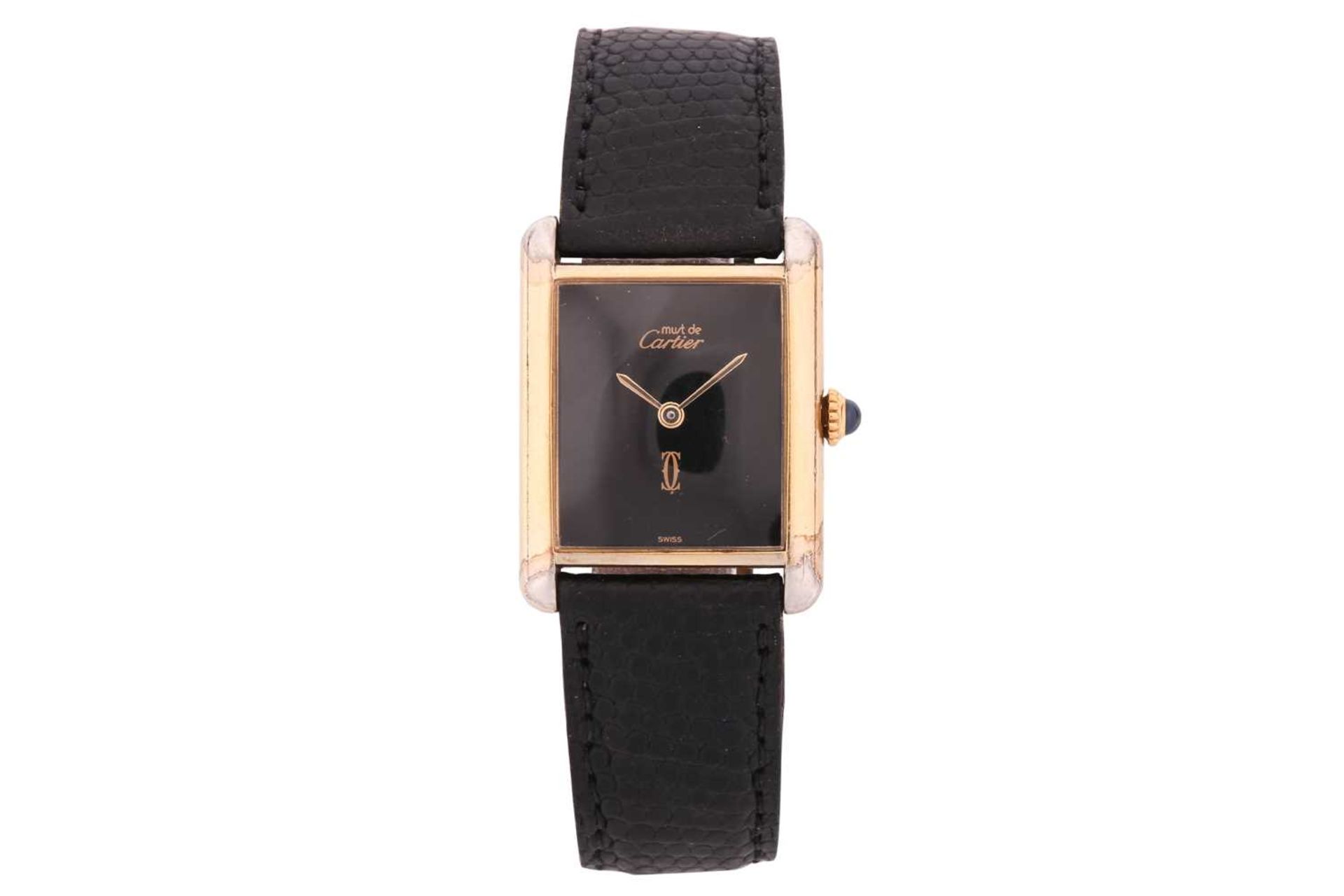 A Must De Cartier silver gilt mechanical watch with a black dial Serial: 6 039295 Case Material: