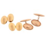 Two pairs of gold cufflinks; a plain oval pair with English hallmarks for 15ct gold and an