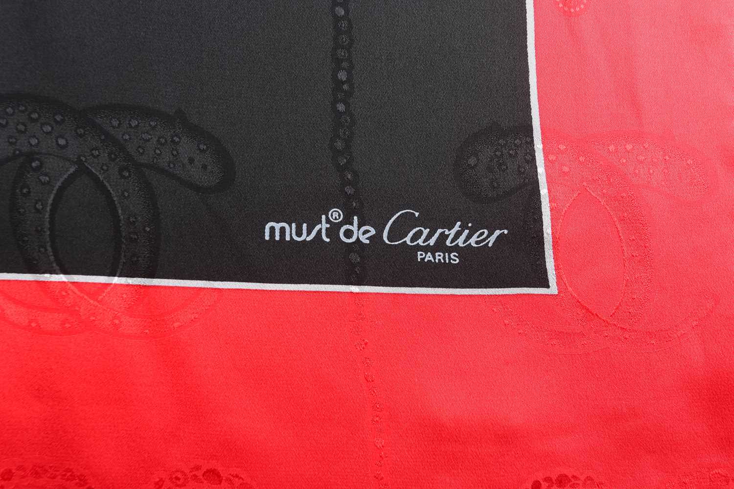 Must De Cartier - two printed silk square scarves; one with jewellery motif on a jacquard black - Image 7 of 10