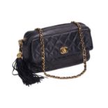 Chanel - a diamond-quilted camera bag in navy lambskin leather, circa 1995, rectangular body with