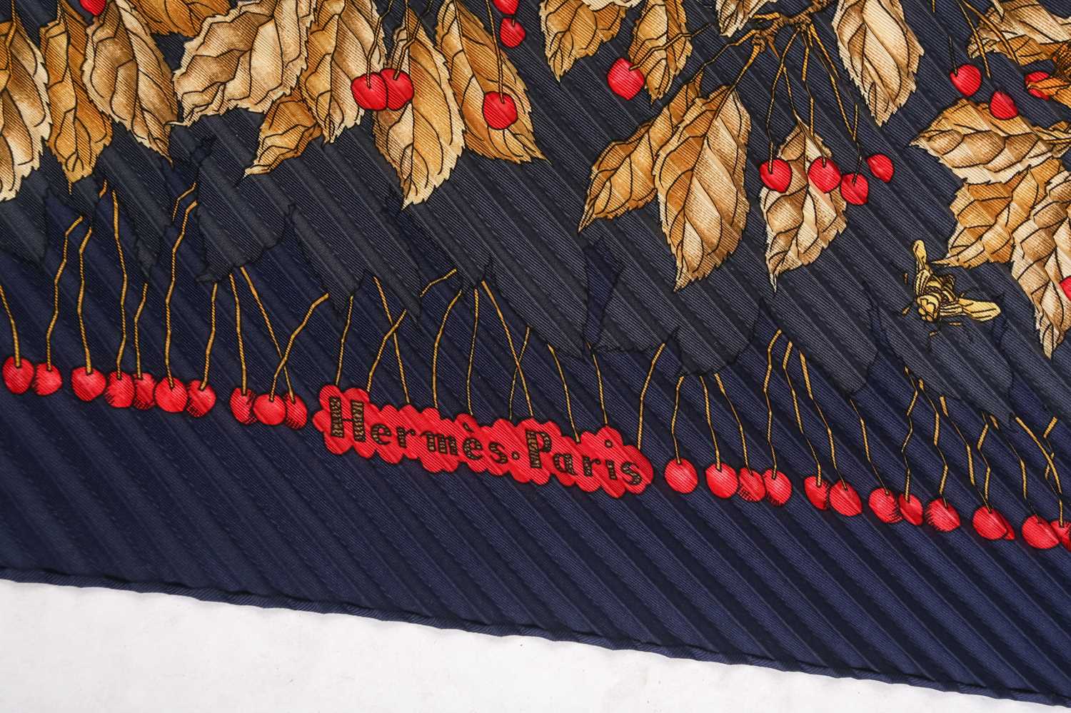 Hermès - 'Les Merises (Cherries)' silk pleated scarf in navy and gold colourway, illustrated with - Image 3 of 6