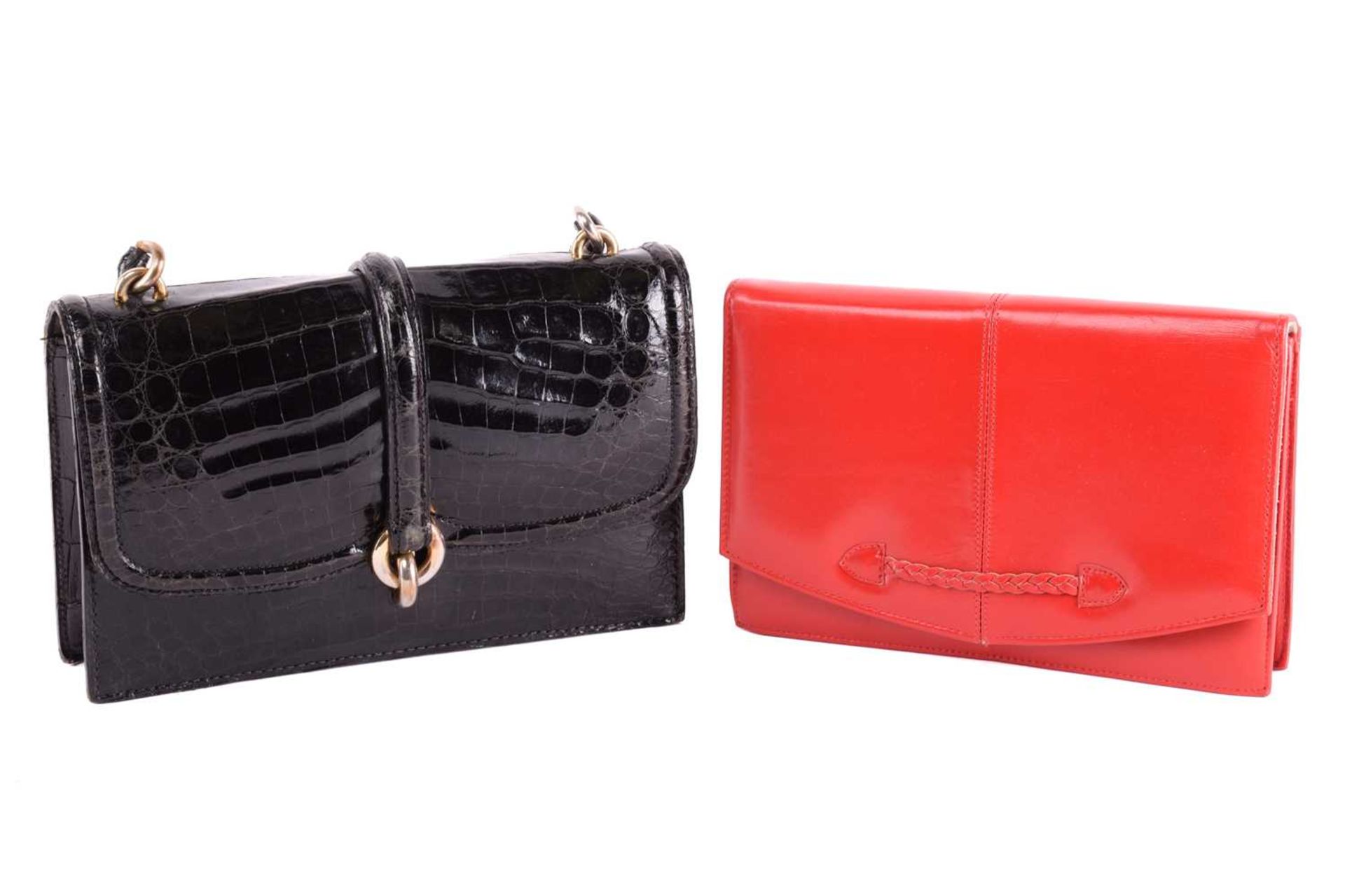 Two leather bags; including a black crocodile skin top handle handbag with gold-tone twist lock, and