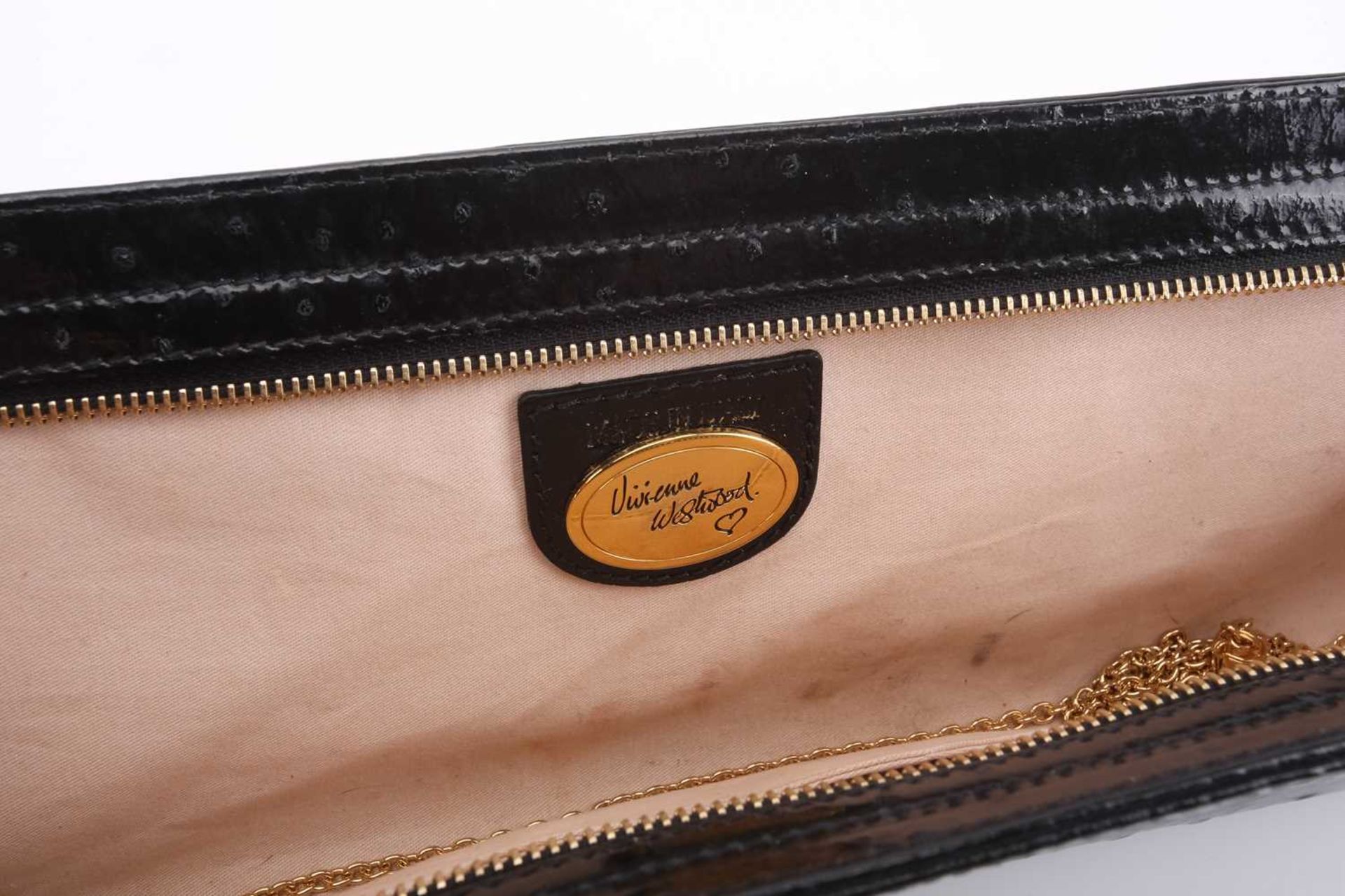 Vivienne Westwood - an extra long clutch in black patent mock ostrich leather, embellished with - Image 5 of 7