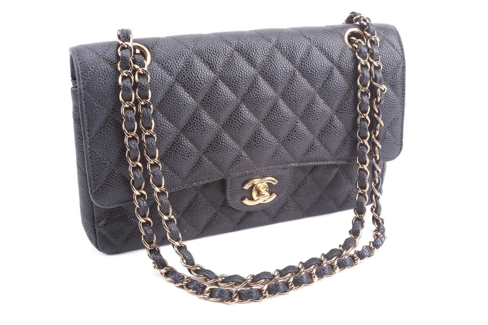 Chanel - a medium classic double flap bag in black diamond-quilted caviar leather, circa 2003,