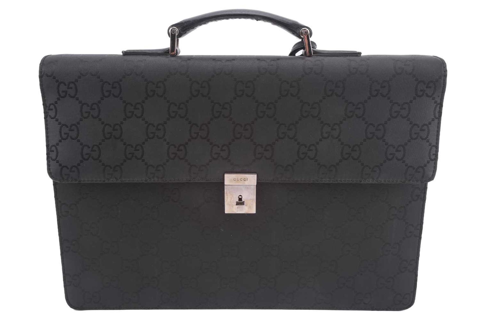 Gucci - a large briefcase in black jacquard nylon with black leather trims, flap fastens with a - Image 2 of 8
