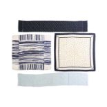 A group of four silk scarves; including a Yves Saint Laurent navy and white logo silk square