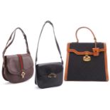Gucci - two shoulder bags and a handbag, circa 1950-70; including a black leather shoulder bag