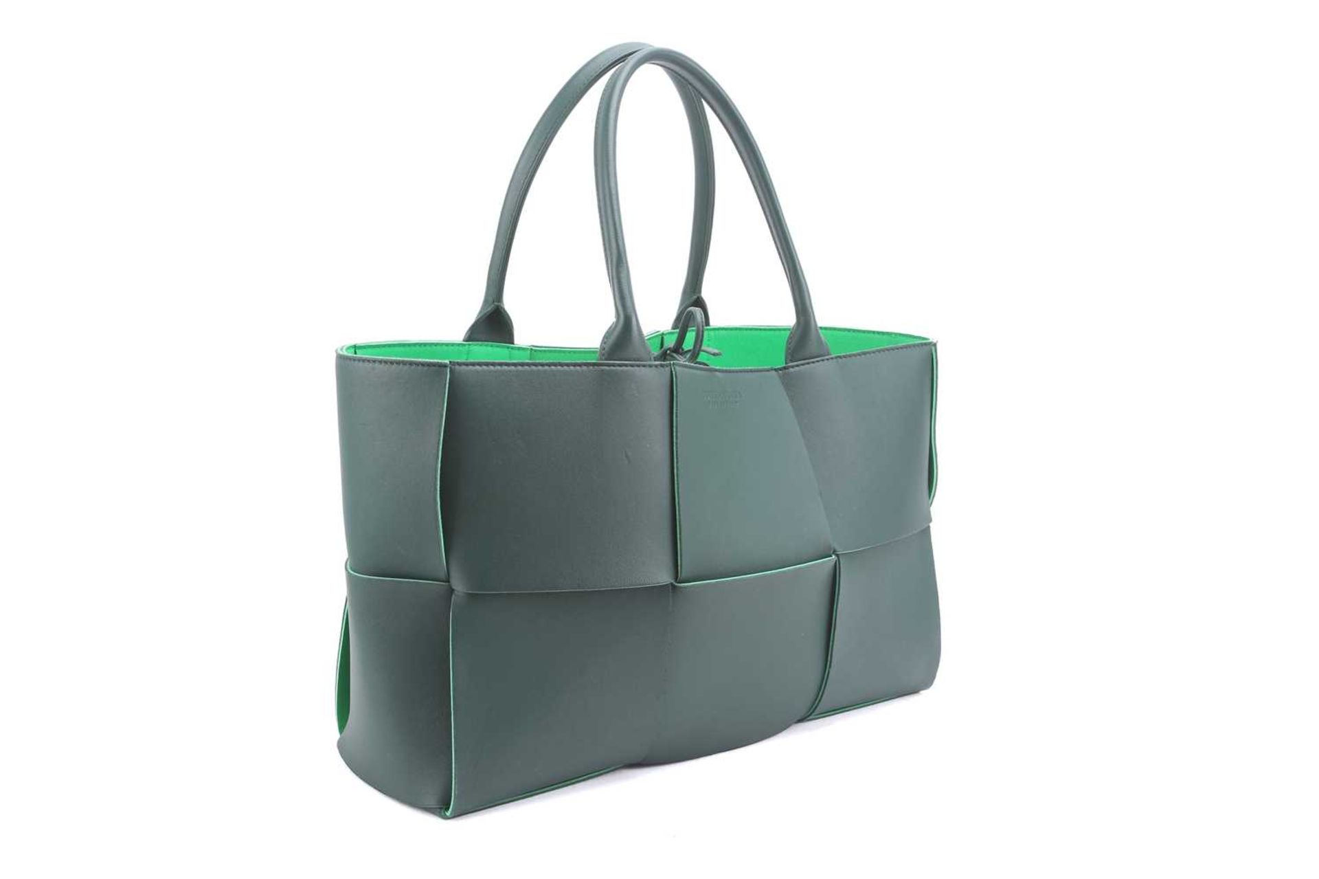 Bottega Veneta - a medium 'Arco' tote in hunter green and lime lambskin bonded leather, woven basket