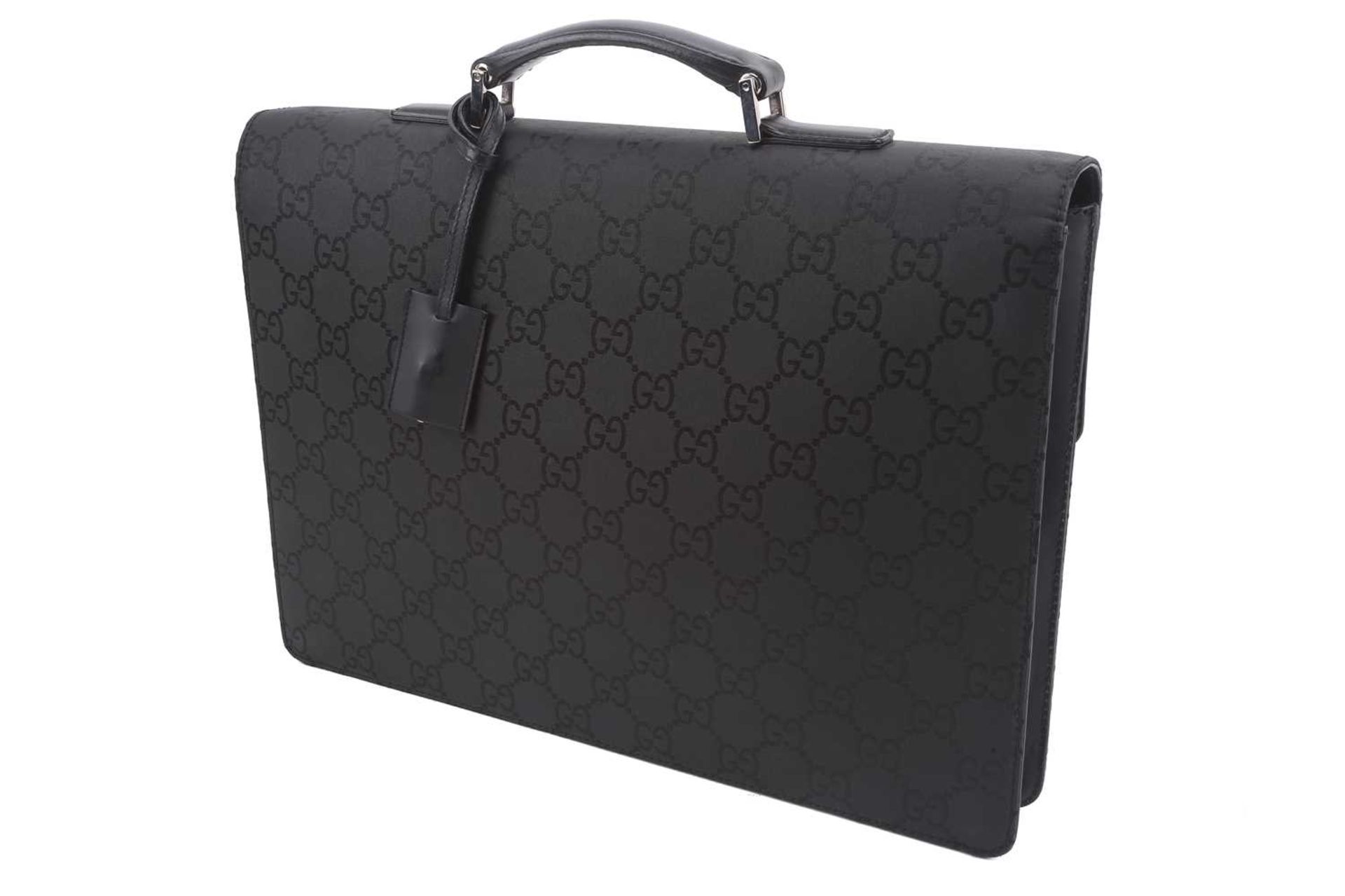 Gucci - a large briefcase in black jacquard nylon with black leather trims, flap fastens with a - Image 3 of 8