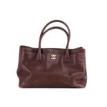 Chanel - an Executive tote bag in hazelnut brown grained leather, circa 1989, constructed with