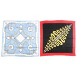 Must De Cartier - two printed silk square scarves; one with jewellery motif on a jacquard black