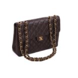 Chanel - a Jumbo classic single flap bag in brown diamond-quilted caviar leather, circa 2002,